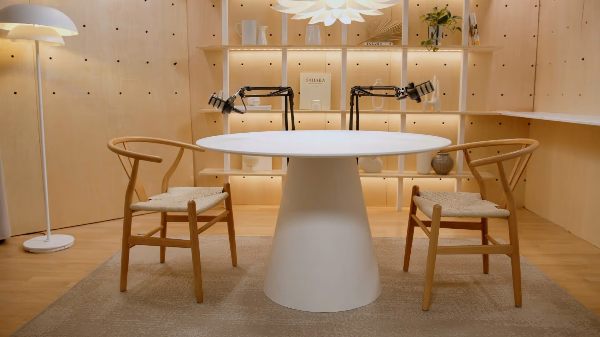 Classic podcast studio setup with table and chairs